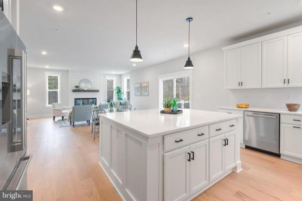 Dining room, Fireplace, Interior, Kitchen, Living room, Pendant Lights, Recessed Lighting, Stainless Steel Appliances, Wood Texture Flooring
