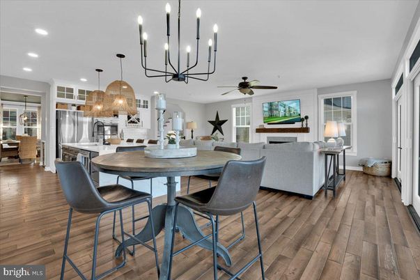 Dining room, Fireplace, Interior, Kitchen, Living room, Pendant Lights, Recessed Lighting, Stainless Steel Appliances, Wood Texture Flooring
