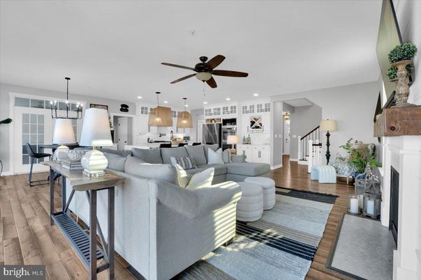 Dining room, Fireplace, Interior, Kitchen, Living room, Pendant Lights, Recessed Lighting, Stainless Steel Appliances, Wood Texture Flooring