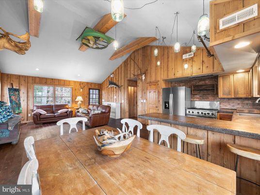 Dining room, Interior, Kitchen, Living room, Pendant Lights, Recessed Lighting, Stainless Steel Appliances, Wooden Beams, Wood Texture Flooring, Wooden Walls