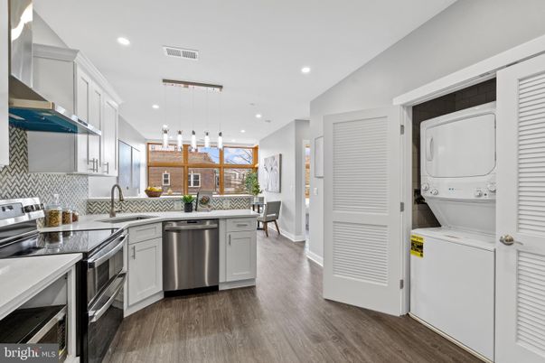 Interior, Kitchen, Pendant Lights, Recessed Lighting, Stainless Steel Appliances, Utility Closets, Washer, Wood Texture Flooring