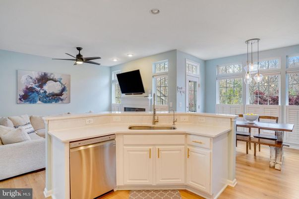 Dining room, Fireplace, Interior, Kitchen, Pendant Lights, Recessed Lighting, Stainless Steel Appliances, Wood Texture Flooring