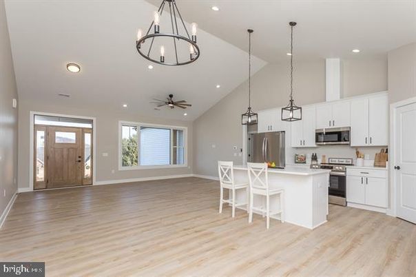 Chandelier, Interior, Kitchen, Pendant Lights, Recessed Lighting, Stainless Steel Appliances, Wood Texture Flooring