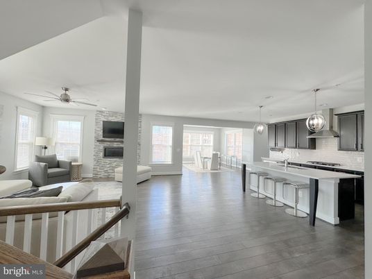 Fireplace, Interior, Kitchen, Living room, Pendant Lights, Stainless Steel Appliances, Wood Texture Flooring