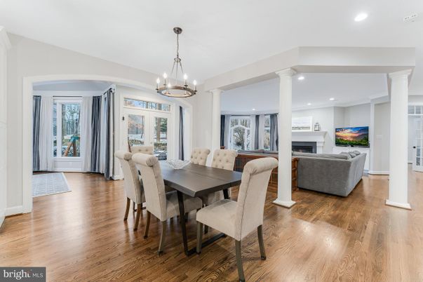 Chandelier, Dining room, Fireplace, Interior, Living room, Pendant Lights, Recessed Lighting, Wood Texture Flooring