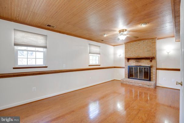 Empty room, Fireplace, Interior, Recessed Lighting, Stone Walls, Wooden Ceilings, Wood Texture Flooring