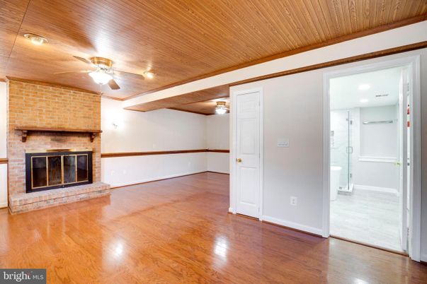 Empty room, Fireplace, Interior, Recessed Lighting, Stone Walls, Wooden Beams, Wooden Ceilings, Wood Texture Flooring