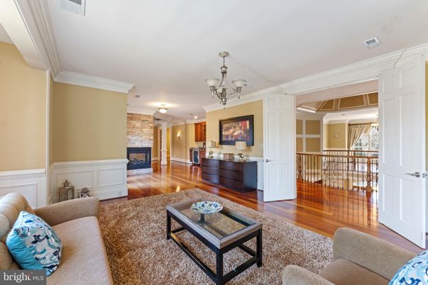 Chandelier, Fireplace, Interior, Living room, Stone Walls, Wood Texture Flooring