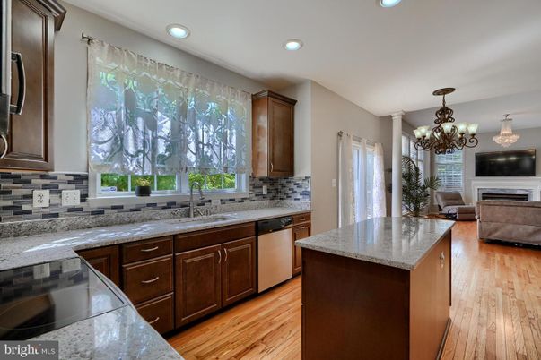 Chandelier, Fireplace, Interior, Kitchen, Recessed Lighting, Wood Texture Flooring