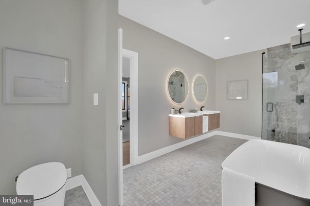 Bathroom, Dual Sink Vanities, Free Standing Baths, Glass Shower, Interior, Marble Walls, Recessed Lighting