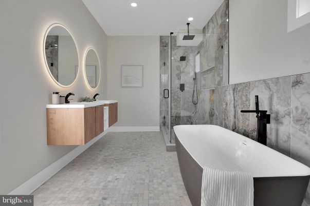 Bathroom, Dual Sink Vanities, Free Standing Baths, Glass Shower, Interior, Marble Walls, Recessed Lighting