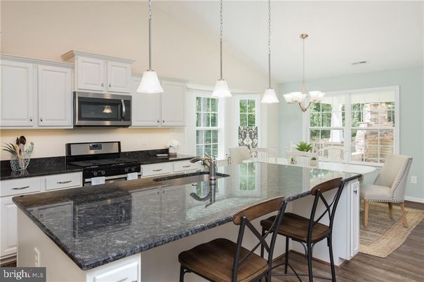 Chandelier, Dining room, Interior, Kitchen, Pendant Lights, Stainless Steel Appliances, Wood Texture Flooring