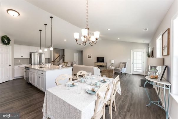 Chandelier, Dining room, Interior, Kitchen, Living room, Pendant Lights, Recessed Lighting, Stainless Steel Appliances, Wood Texture Flooring