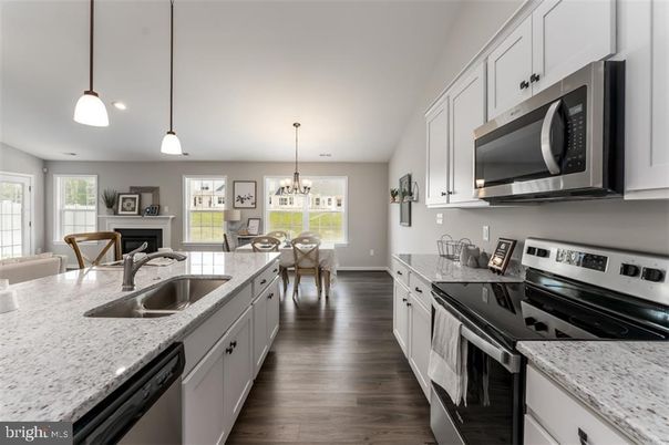 Chandelier, Dining room, Fireplace, Interior, Kitchen, Living room, Pendant Lights, Recessed Lighting, Wood Texture Flooring