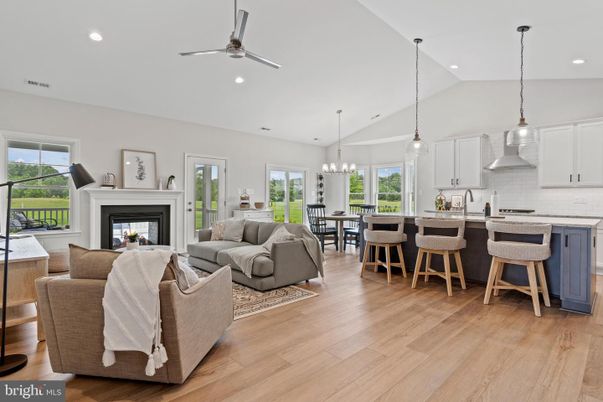 Chandelier, Dining room, Fireplace, Interior, Kitchen, Living room, Pendant Lights, Recessed Lighting, Stainless Steel Appliances, Wood Texture Flooring