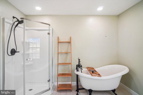 Bathroom, Free Standing Baths, Glass Shower, Interior, Recessed Lighting, Wood Texture Flooring