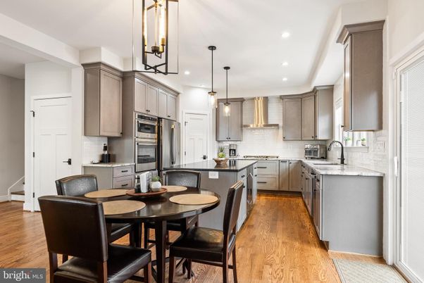 Dining room, Interior, Kitchen, Pendant Lights, Recessed Lighting, Stainless Steel Appliances, Wood Texture Flooring