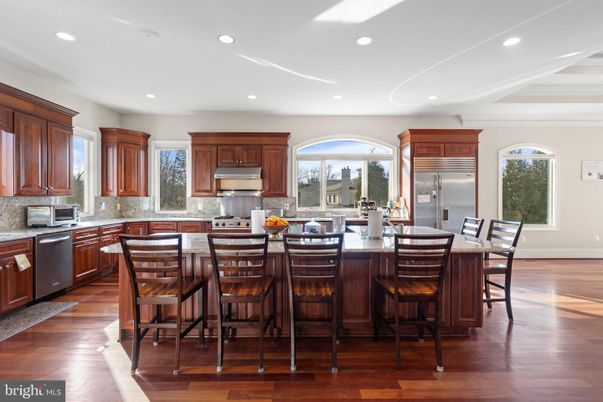 Dining room, Interior, Kitchen, Recessed Lighting, Stainless Steel Appliances, Wood Texture Flooring
