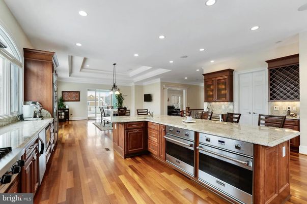 Chandelier, Dining room, Interior, Kitchen, Pendant Lights, Recessed Lighting, Stainless Steel Appliances, Wood Texture Flooring