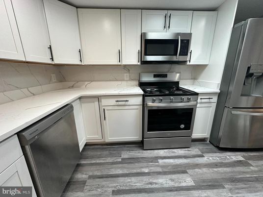 Interior, Kitchen, Marble Walls, Stainless Steel Appliances, Wood Texture Flooring