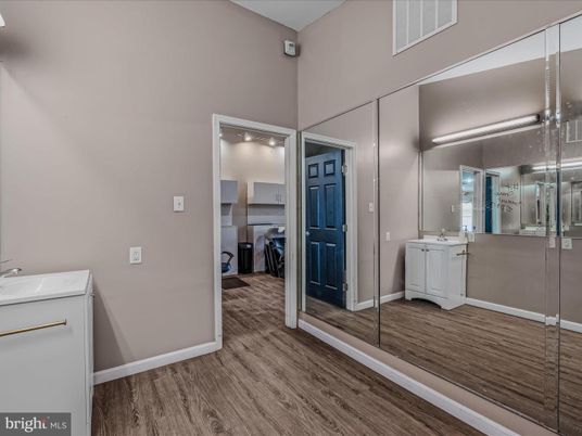 Bathroom, Glass Shower, Interior, Washer, Wood Texture Flooring