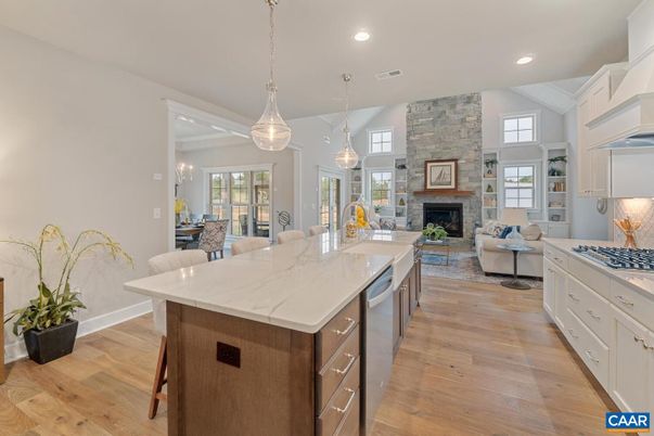 Dining room, Fireplace, Interior, Kitchen, Living room, Pendant Lights, Recessed Lighting, Stainless Steel Appliances, Stone Walls, Wood Texture Flooring