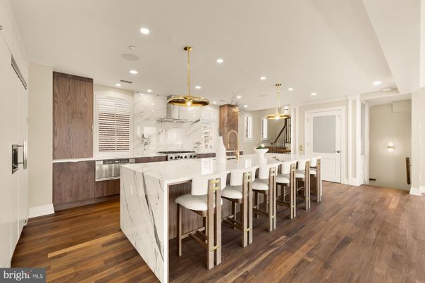 Interior, Kitchen, Marble Walls, Pendant Lights, Recessed Lighting, Stainless Steel Appliances, Wood Texture Flooring