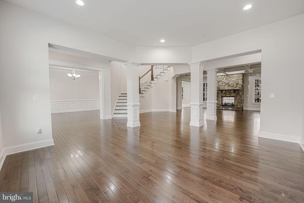 Empty room, Fireplace, Interior, Recessed Lighting, Stone Walls, Wood Texture Flooring