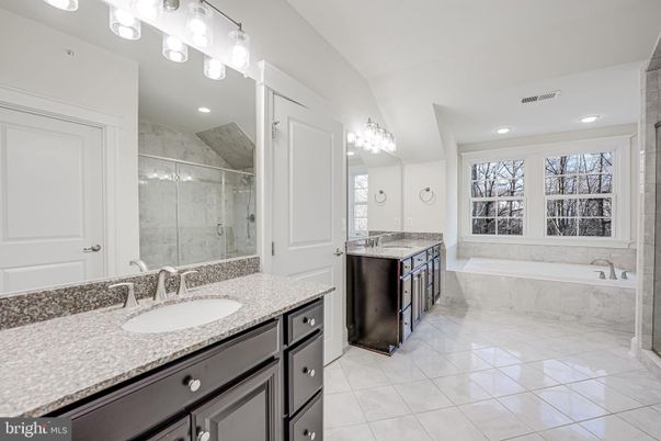 Bathroom, Dual Sink Vanities, Glass Shower, Interior, Marble Walls, Recessed Lighting