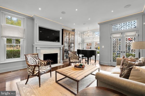 Chandelier, Fireplace, Interior, Living room, Piano, Recessed Lighting, Wood Texture Flooring