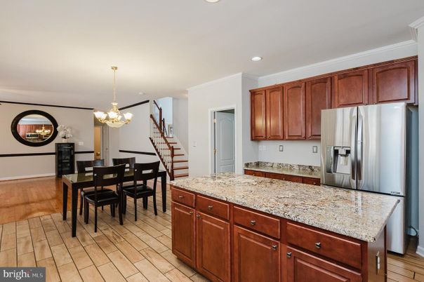 Chandelier, Dining room, Interior, Kitchen, Pendant Lights, Recessed Lighting, Stainless Steel Appliances, Wood Texture Flooring