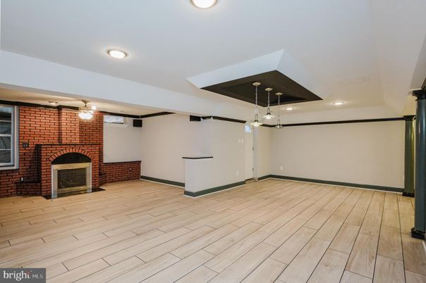 Empty room, Fireplace, Interior, Pendant Lights, Recessed Lighting, Stone Walls, Wood Texture Flooring