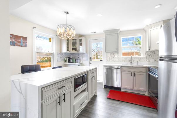 Chandelier, Interior, Kitchen, Recessed Lighting, Stainless Steel Appliances, Wood Texture Flooring