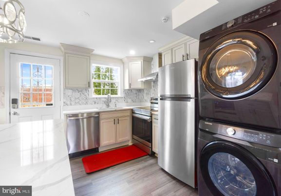 Interior, Kitchen, Recessed Lighting, Stainless Steel Appliances, Washer, Wood Texture Flooring