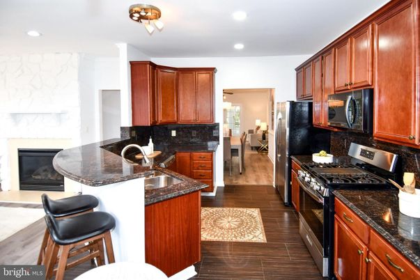 Dining room, Fireplace, Interior, Kitchen, Recessed Lighting, Wood Texture Flooring
