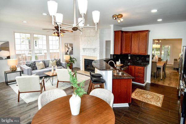 Dining room, Fireplace, Interior, Kitchen, Living room, Recessed Lighting, Wood Texture Flooring