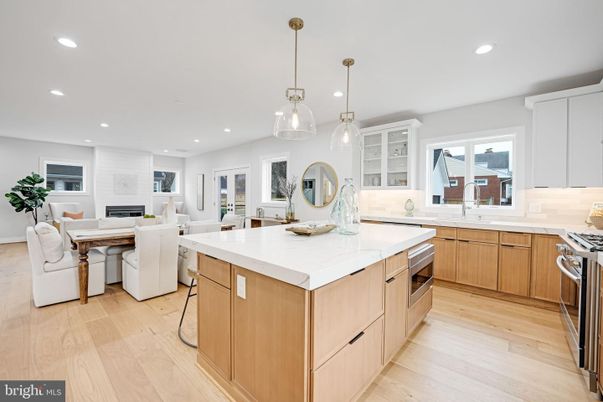 Dining room, Fireplace, Interior, Kitchen, Living room, Pendant Lights, Recessed Lighting, Stainless Steel Appliances, Wood Texture Flooring