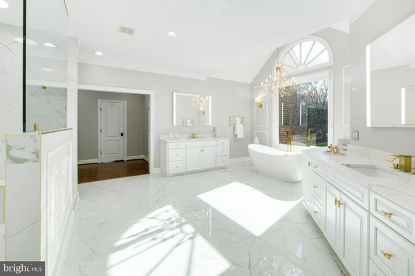Bathroom, Chandelier, Dual Sink Vanities, Free Standing Baths, Interior, Marble, Marble Walls, Recessed Lighting
