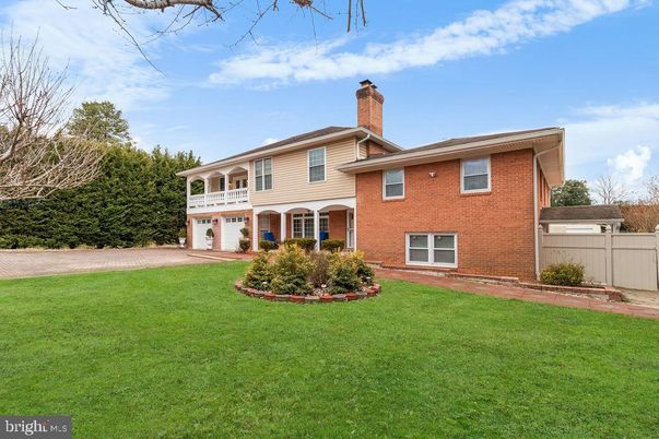 Attached, Backyard, Exterior, Facade, Brick Facade, Split Level