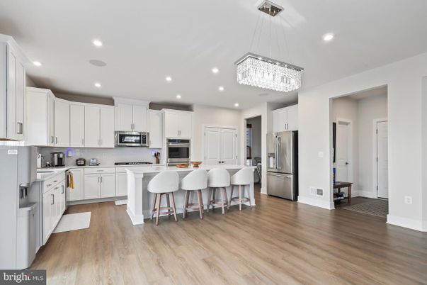 Chandelier, Interior, Kitchen, Pendant Lights, Recessed Lighting, Stainless Steel Appliances, Wood Texture Flooring