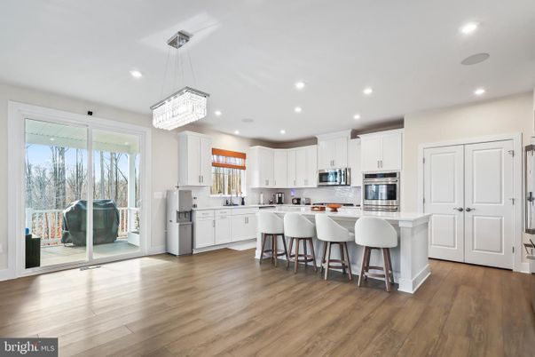 Chandelier, Interior, Kitchen, Pendant Lights, Recessed Lighting, Stainless Steel Appliances, Wood Texture Flooring