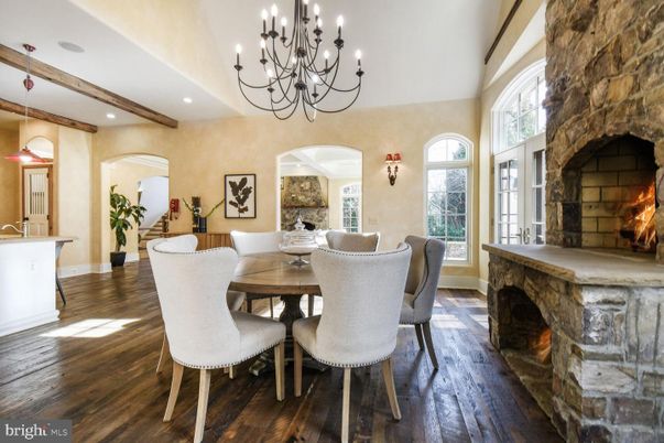 Chandelier, Dining room, Fireplace, Interior, Recessed Lighting, Stone Walls, Wooden Beams, Wood Texture Flooring