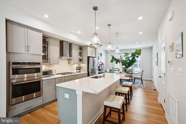 Dining room, Interior, Kitchen, Pendant Lights, Recessed Lighting, Stainless Steel Appliances, Wood Texture Flooring