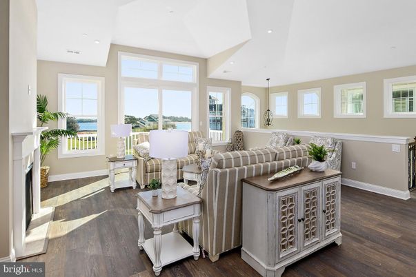 Fireplace, Interior, Living room, Recessed Lighting, Water, Wood Texture Flooring