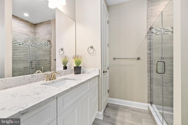 Bathroom, Dual Sink Vanities, Glass Shower, Interior, Recessed Lighting, Wood Texture Flooring