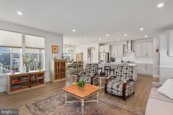 Chandelier, Dining room, Interior, Kitchen, Living room, Recessed Lighting, Stainless Steel Appliances, Wood Texture Flooring