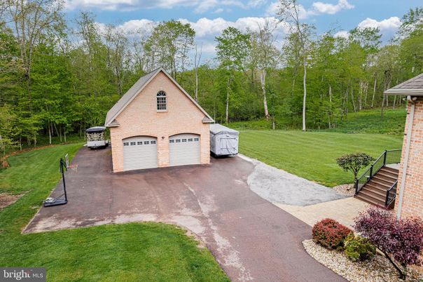 Attached, Backyard, Exterior, Facade, Brick Facade, None