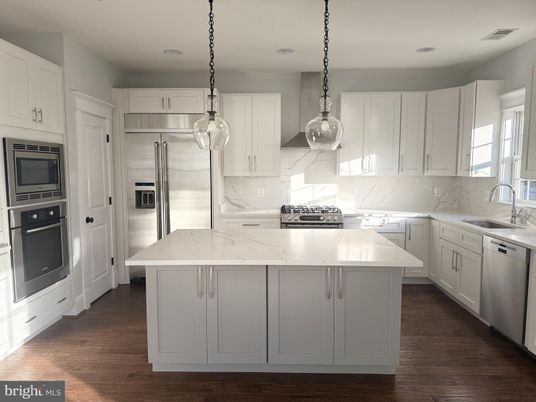 Interior, Kitchen, Marble Walls, Pendant Lights, Recessed Lighting, Stainless Steel Appliances, Wood Texture Flooring