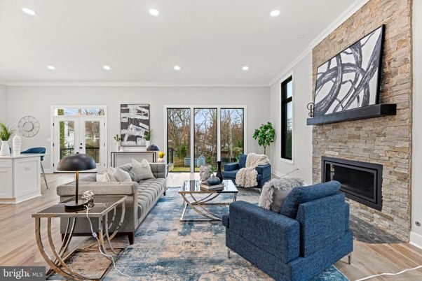 Fireplace, Interior, Living room, Recessed Lighting, Stone Walls, Wood Texture Flooring