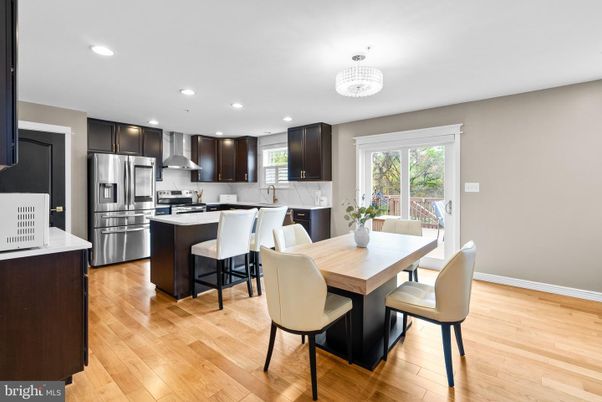 Chandelier, Dining room, Interior, Kitchen, Recessed Lighting, Stainless Steel Appliances, Wood Texture Flooring